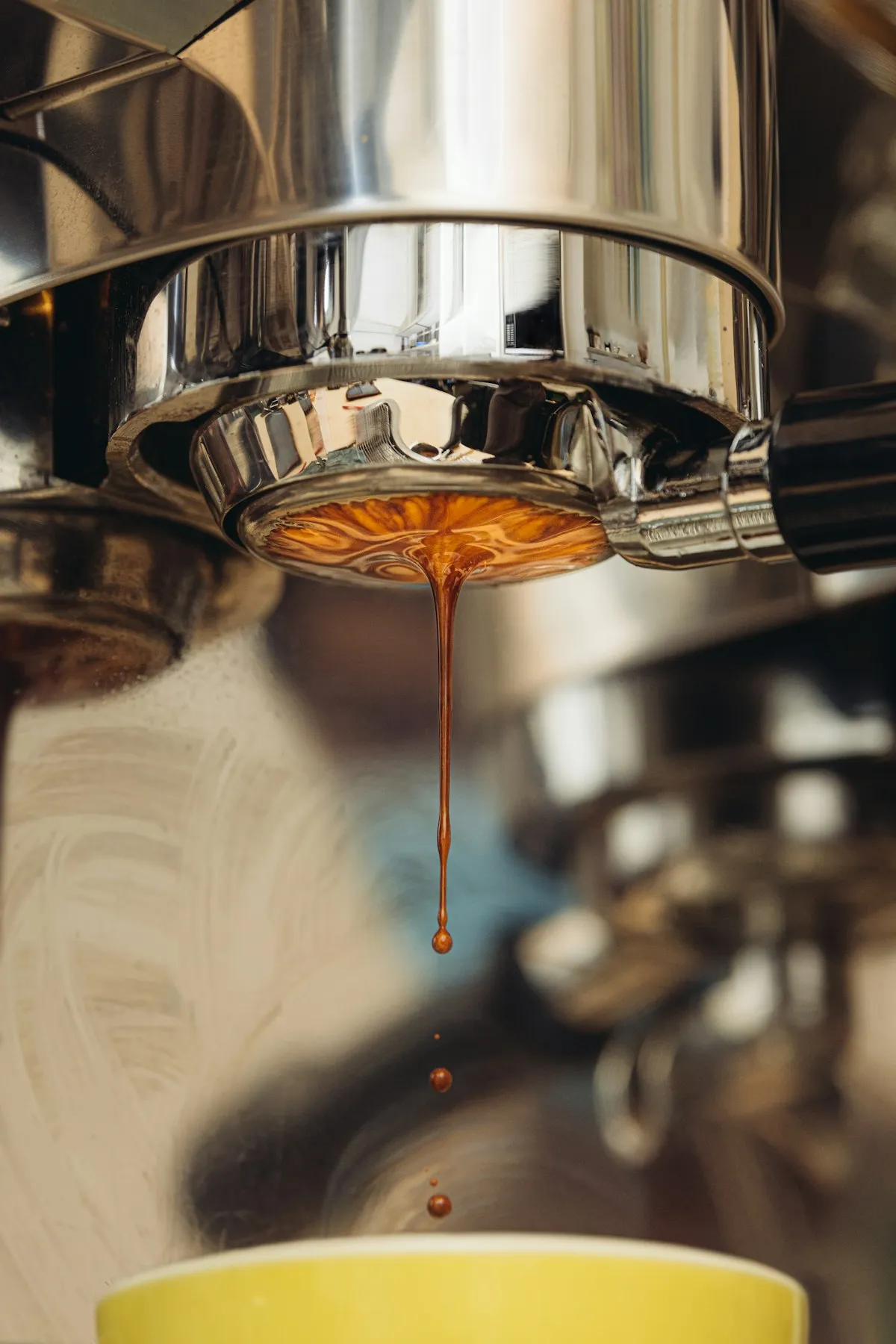 Espresso dripping from a bottomless portafilter